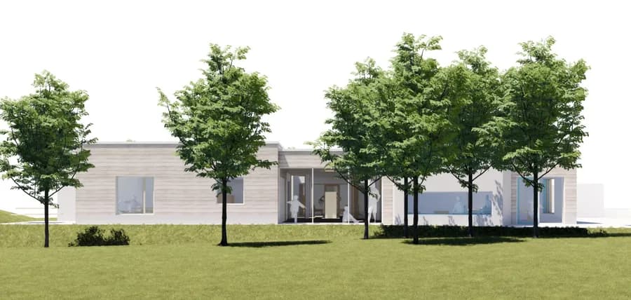 Husfacade med store vinduer set fra haven